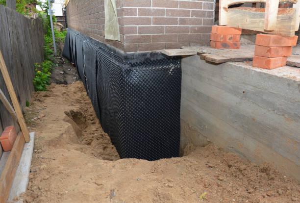 Happy homeowners after waterproofing job in Waterford